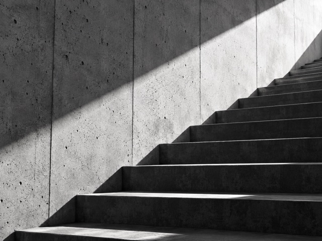 Sunlight falling across a concrete stairway.